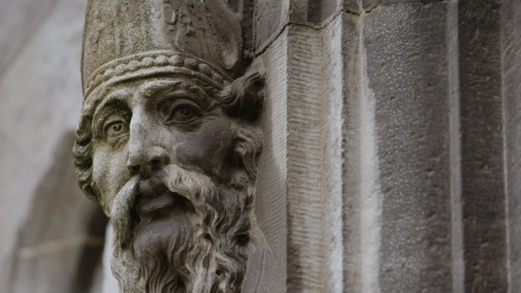 Close up photograph of stone carving of St Patrick on exterior of Chapel Royal, Dublin Castle