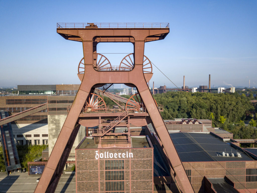 Photo of industrial machinery and buildings at the Zollverein World Heritage Site, a former coal mine.